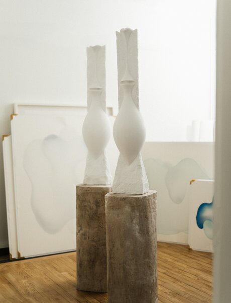 Studio portrait of sculptural white marble forms at Amanzoe art exhibit, Greece.