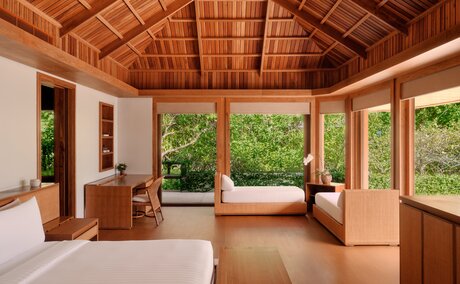Grand Beach Pool Casita with wooden architecture and ocean views at Amanpulo, Philippines.
