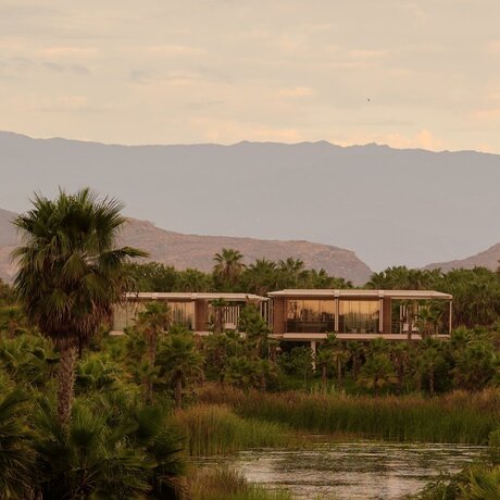 Horizon Casita exterior overlooking the river at Amanvari, Mexico, at dusk.