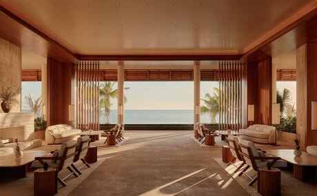 Casa Grande spa relaxation area at Amanvari, Mexico, with wooden beams and floor-to-ceiling windows.