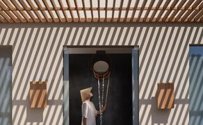Ocean Pool Residence entrance at Amanoi with striped shadows cast across wooden decking.