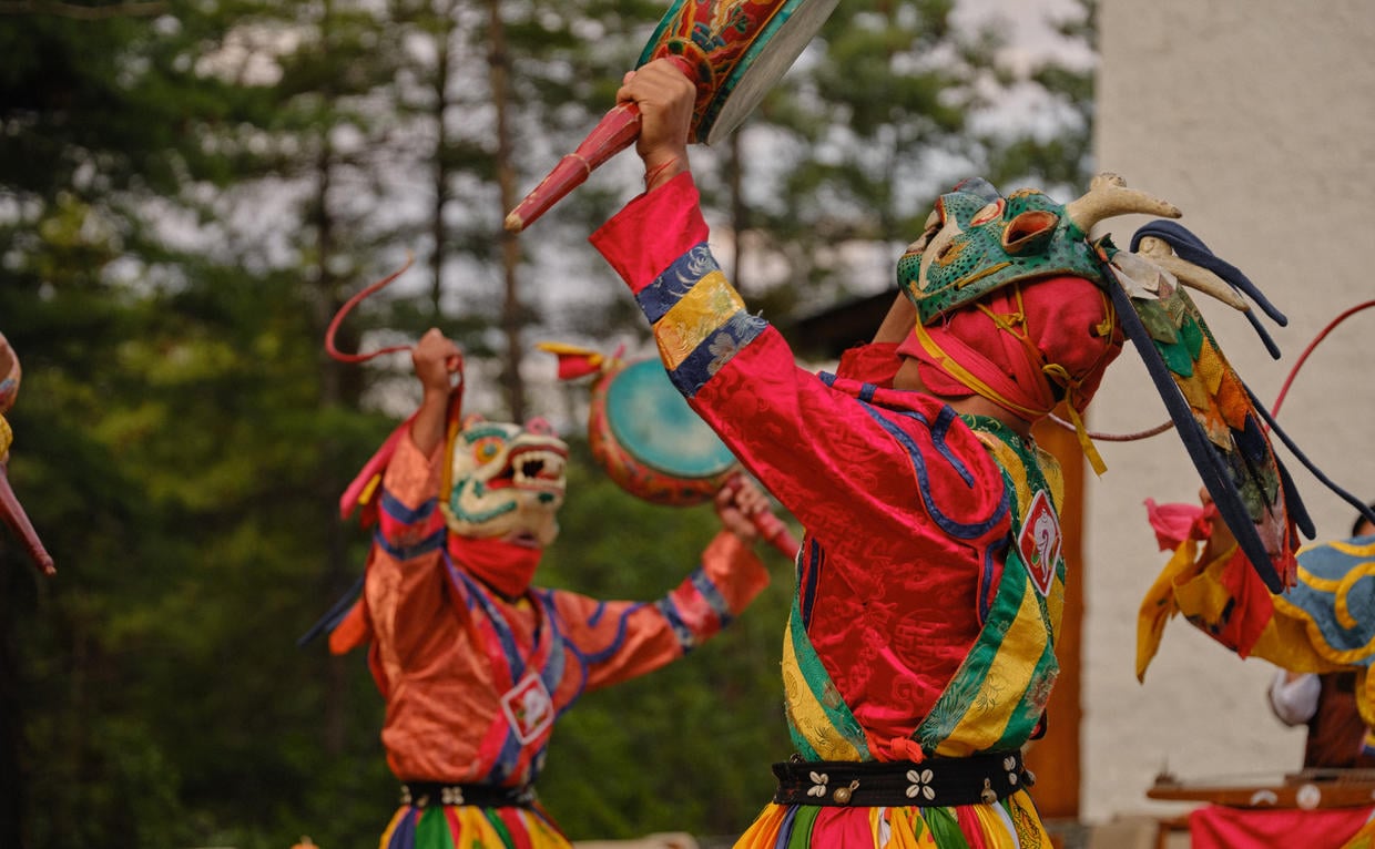 amankora-bhutan-experience-thimphu-lodge-cultural-dance-performance-at-the-courtyard-entertainment.jpg