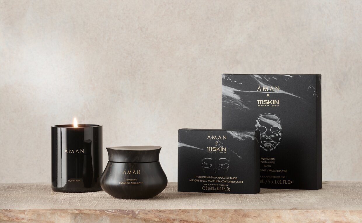Aman Essentials Holiday Skin Nourishing Pathway Gift Set with black packaging and containers.