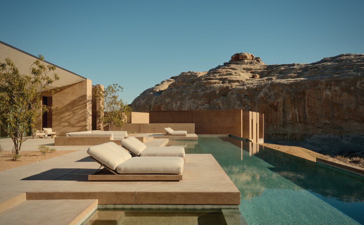 Six-bedroom villa pool terrace at Amangiri overlooking desert landscape at dusk.
