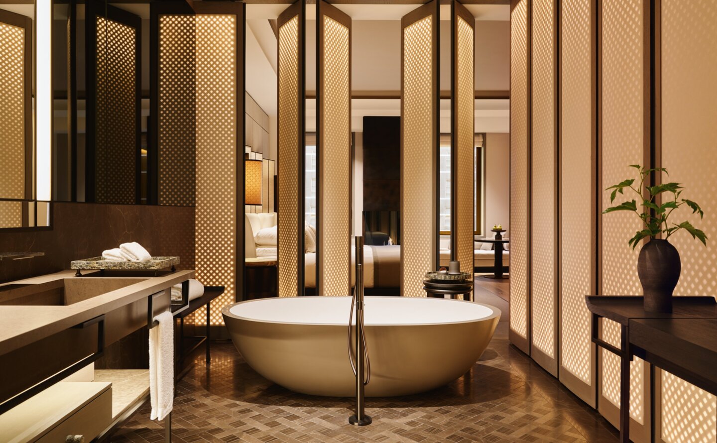 Junior Suite bathroom at Aman New York with freestanding bathtub and marble accents.