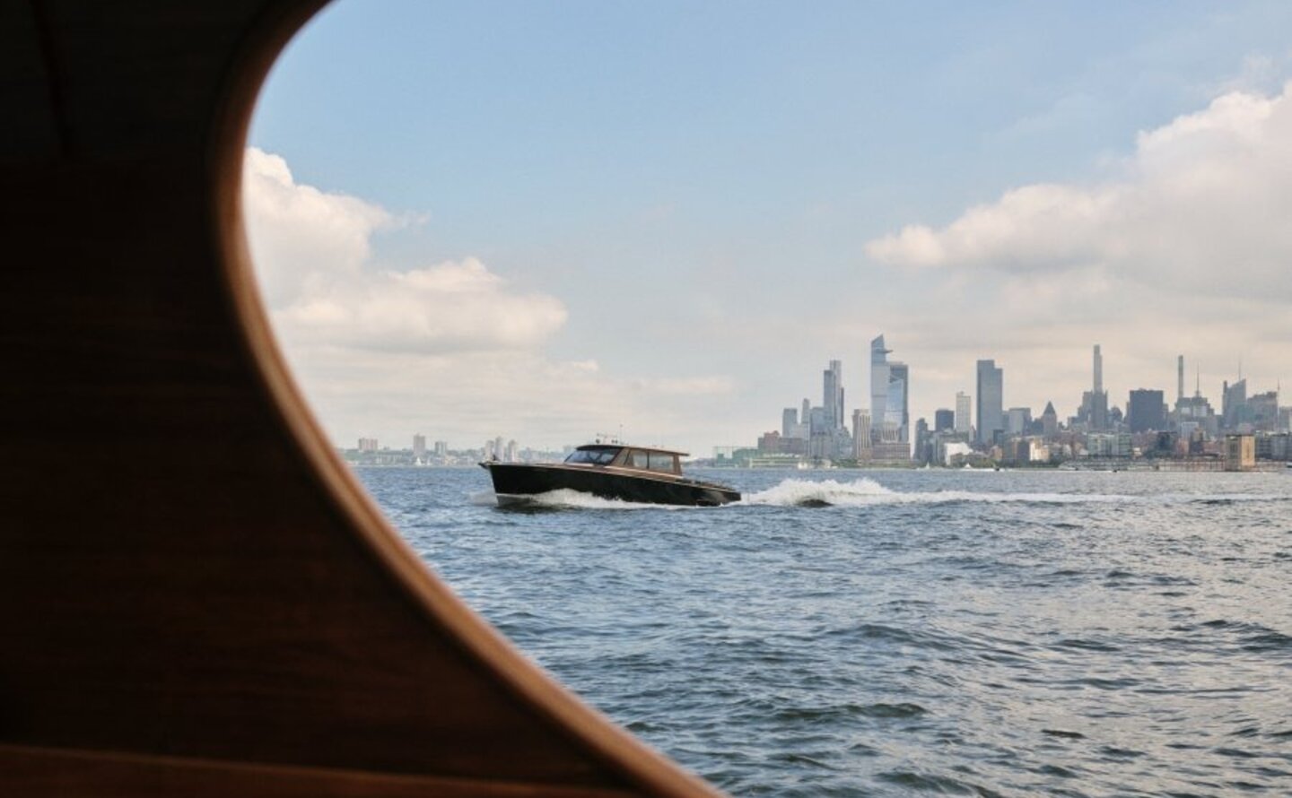 View of Manhattan skyline from a boat on the Hudson River, New York.