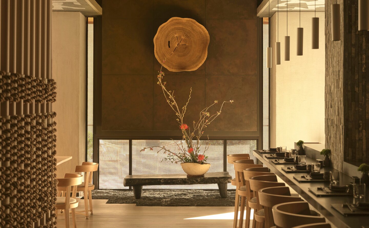 Minimalist spa corridor at Aman New York with natural wood accents and soft lighting.