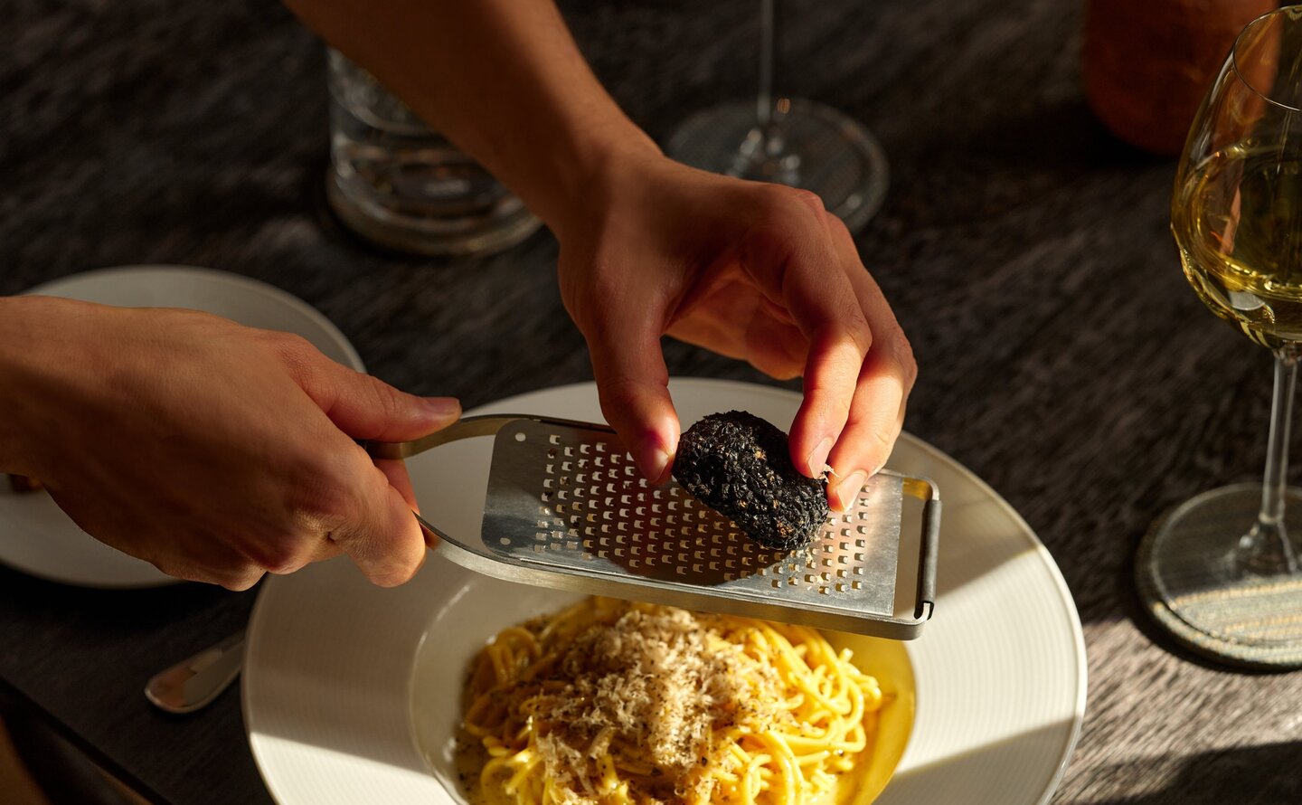 Homemade tagliolini with Ronny Brook butter and black summer truffle at Aman New York.