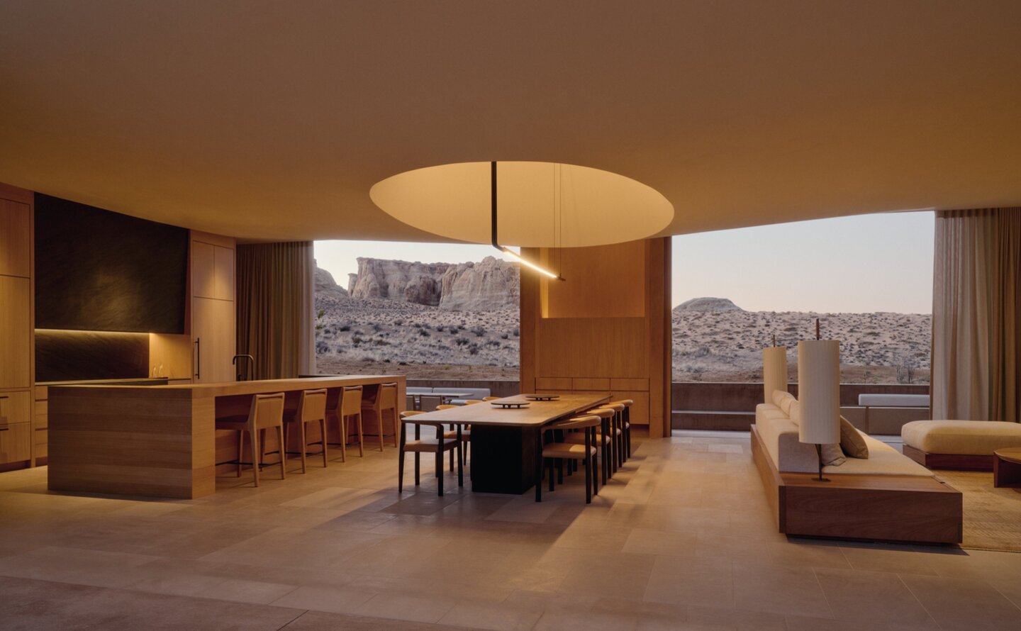 Six-bedroom villa living and dining room at Amangiri with desert views and warm wood furnishings.