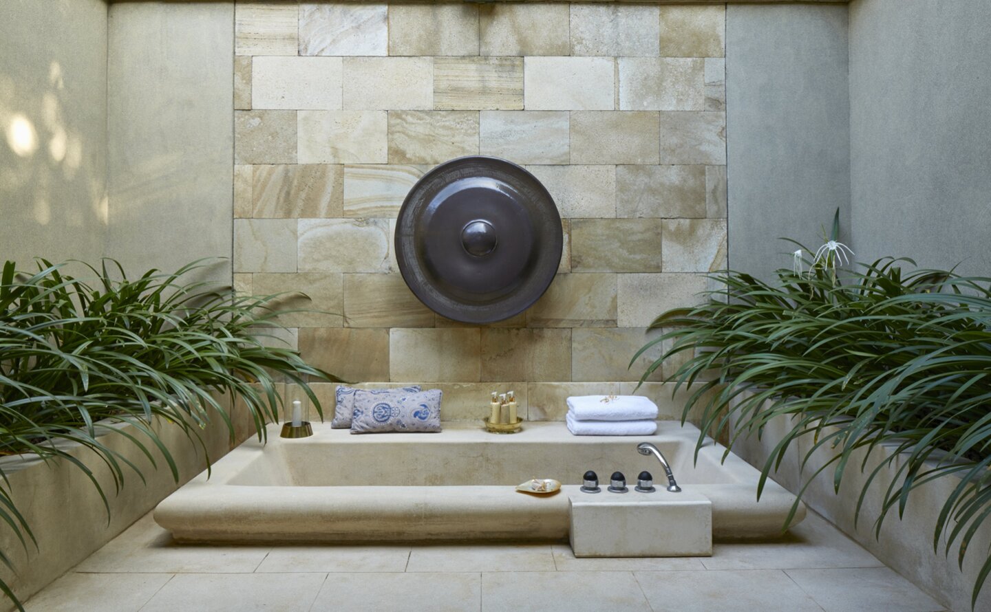 Outdoor bathtub surrounded by plants at Amanjiwo, Indonesia.