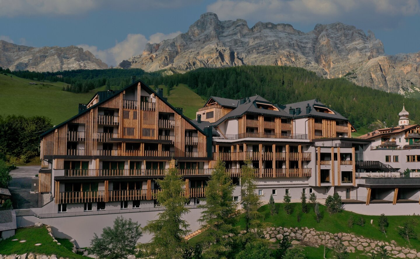 Aman Rosa Alpina property exterior set against the Dolomite mountains in Italy.