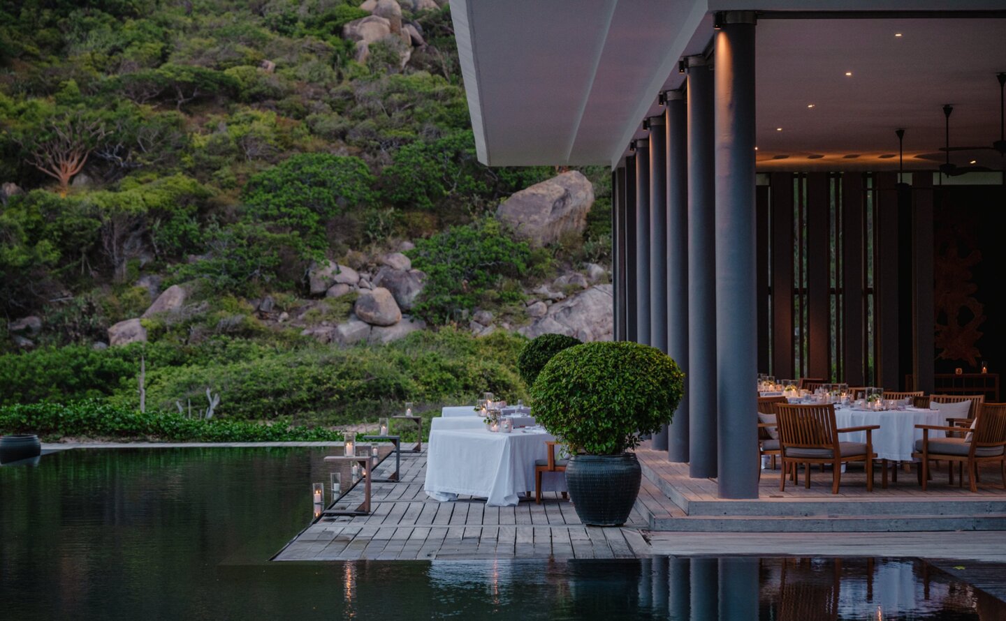Beach Club Restaurant terrace at Amanoi overlooking the sea at dusk, Vietnam.