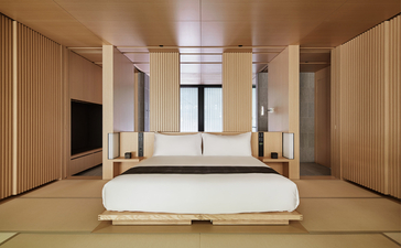 Principal bedroom at Aman Kyoto with tatami flooring, sliding doors, and minimalist design.