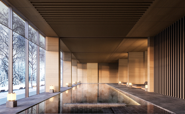 Spa swimming pool at Aman Niseko with floor-to-ceiling windows overlooking snow-covered landscape.