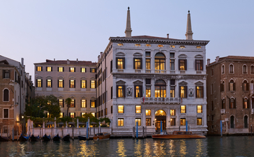 Palazzo façade illuminated at night along the Grand Canal, Aman Venice.