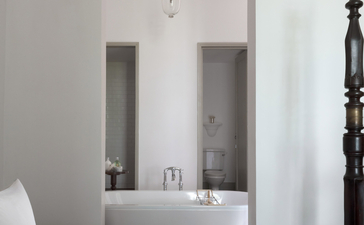 Chamber at Amangalla with twin vanities and minimalist décor, Sri Lanka.