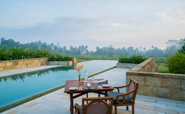 Dalem Jiwo Suite plunge pool overlooking rice paddies at Amanjiwo, Indonesia.