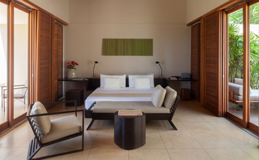 Garden Pool Suite at Amanwella, Sri Lanka, featuring a principal bedroom with adjoining plunge pool and garden views.