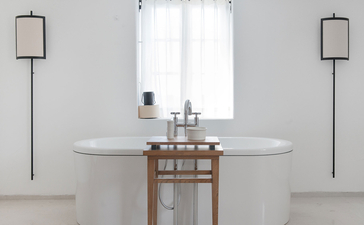 Principal bedroom ensuite with circular marble sink and wooden vanity at Aman Sveti Stefan.