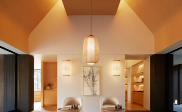 Amanemu resort gallery: serene spa interior with vaulted ceiling, warm ambient lighting, and minimalist furnishings.
