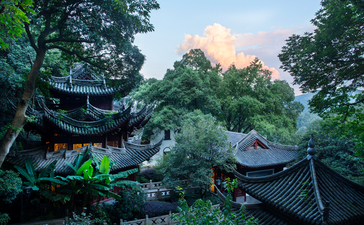 Amanfayun's traditional pavilions nestled amongst verdant gardens and ancient trees.