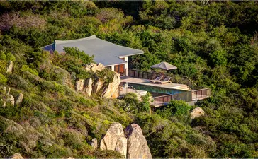 Ocean pool villa at Amanoi perched on clifftop overlooking Vietnamese coastline.