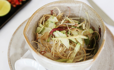 Cambodian noodle soup served in a white bowl at Amansara.