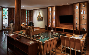 Eight-bedroom garden villa games room with wooden panelling, foosball table, and entertainment area at Amanpuri resort, Thailand.