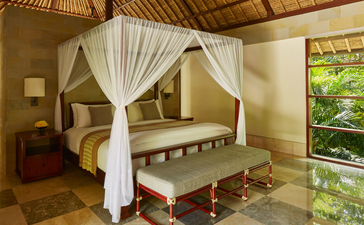 Principal bedroom with four-poster canopy bed at Aman Villas at Nusa Dua, Bali.
