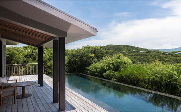 Mountain pool villa at Amanoi overlooking forested Vietnamese landscape and infinity pool.