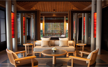Mountain Pool Villa lounge at Amanoi with wooden furnishings and red silk lanterns.