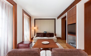 Queen Marija Suite at Aman Sveti Stefan, with wooden furnishings and terracotta floor in Montenegro.