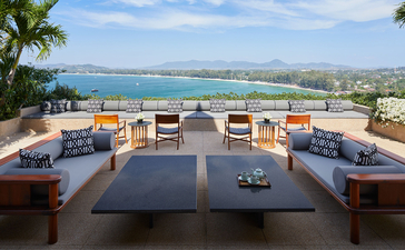 Terrace with dining area overlooking the Andaman Sea at Amanpuri resort, Thailand.