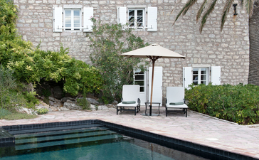 Sveti Stefan Suite plunge pool with stone courtyard and Mediterranean architecture at Aman Sveti Stefan, Montenegro.