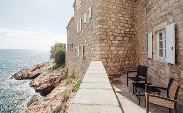 Three-bedroom stone cottage with seaside pathway at Aman Sveti Stefan, Montenegro.