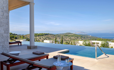 Villa with infinity pool overlooking the Aegean Sea at Amanzoe resort, Greece.