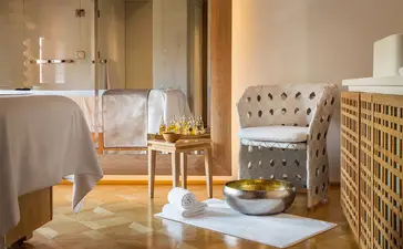 Spa wellness area at Aman Venice with plunge pool, wooden accents, and neutral tones.