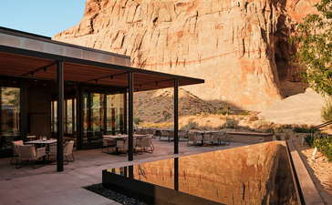 Sarika dining pavilion at Amangiri with sandstone cliffs and desert landscape beyond.