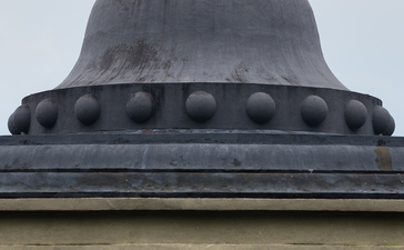 Domed roof with circular details at Amanjiwo, framed by classical columns below.