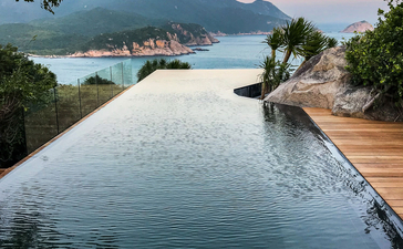 Infinity plunge pool overlooking Halong Bay at Amanoi at sunset.