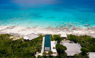 Five-bedroom artist villa at Amanyara with infinity pool overlooking turquoise waters and white sand beach.