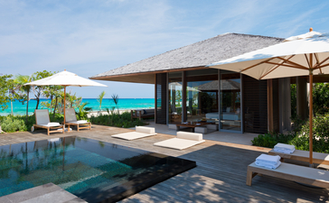 Four-bedroom ocean villa at Amanyara with infinity pool overlooking turquoise waters.