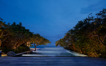 Swimming pool at Amanoi overlooking the ocean at dusk, Vietnam.