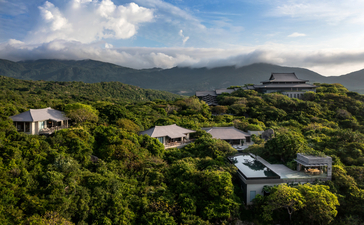Aerial view of four-bedroom ocean pool family residence at Amanoi, Vietnam, nestled among verdant hills.
