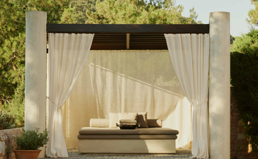 Garden View Pavilion with daybed beside reflecting pool at Amanruya, Turkey.