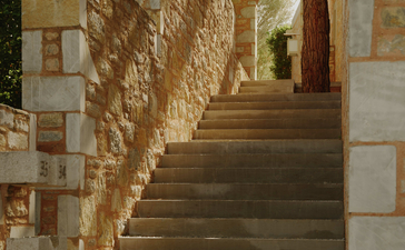 Stone staircase with archway at Amanruya, Turkey resort architecture.
