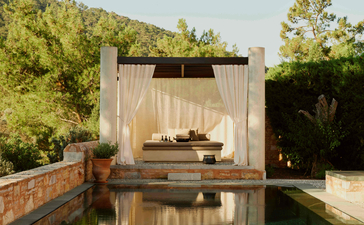 Garden pavilion with integrated plunge pool overlooking verdant grounds at Amanruya, Turkey.