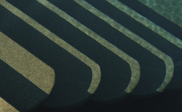Overhead view of poolside loungers casting geometric shadows at Amanruya, Turkey.