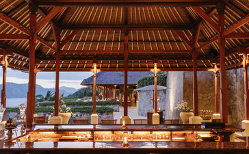 Bar at Amankila resort with timber ceiling and ocean views.
