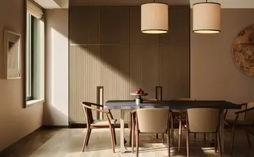 Corner suite dining area at Aman New York, with natural light, wooden table, and mid-century chairs.
